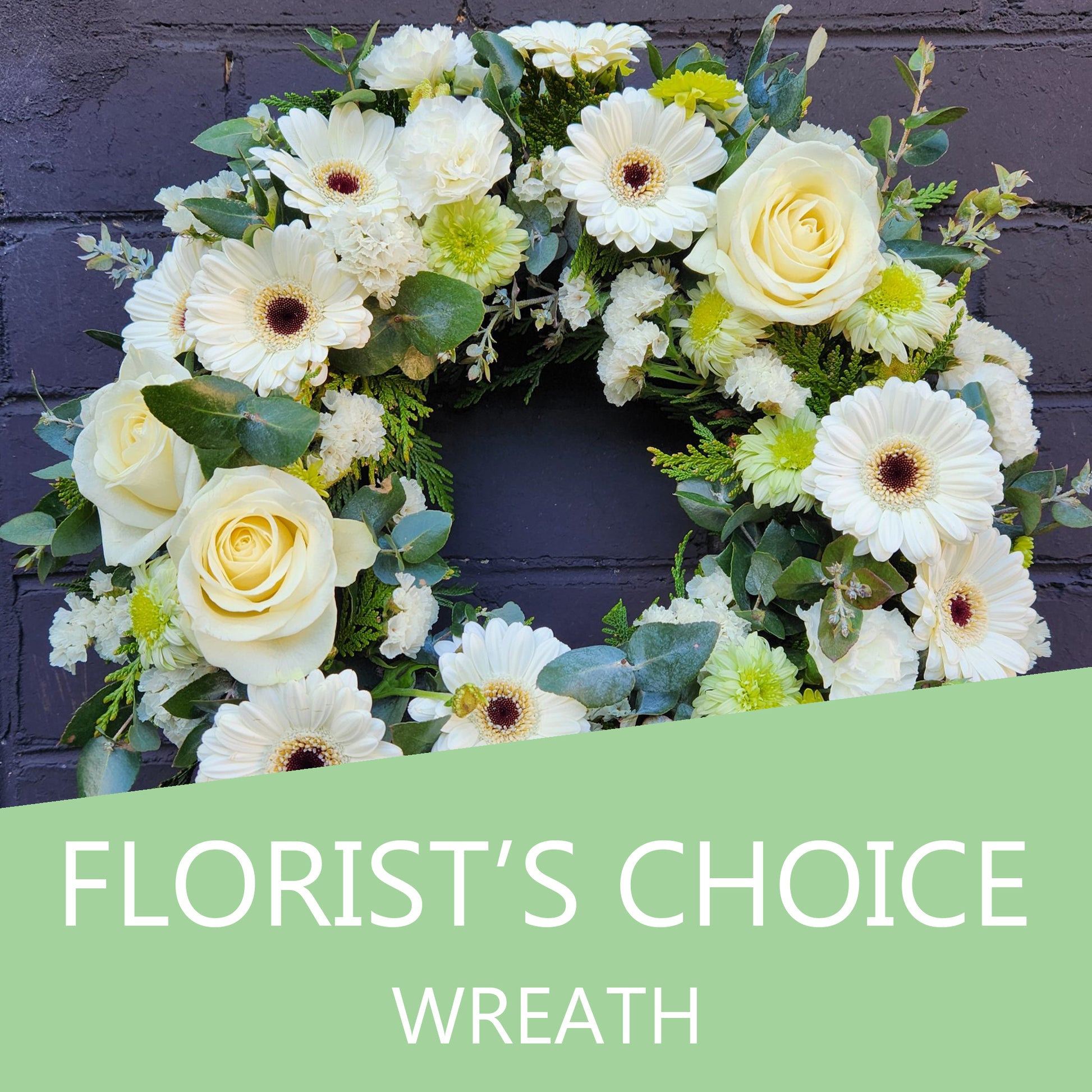 Beautiful florist's choice flower wreath featuring vibrant seasonal blooms, arranged in a circular design, by Cattle Dog Café and Florist.